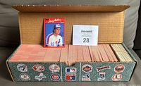 Open factory box showing organized stacks of cards and Larry Walker card displayed