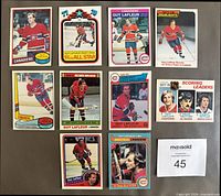 Front view of all 10 Guy Lafleur hockey cards in top-loaders