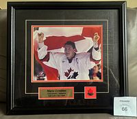 Front view of framed Mario Lemieux Olympic photo, mat, plaque and pin visible