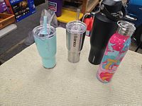 Front view of all four drinkware items