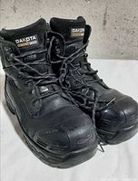 Oblique view of both boots showing uppers, laces, toe guards