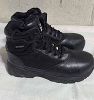 Left side profile of both boots showing leather toe and canvas upper
