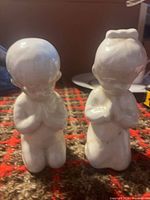 Front view of both figurines