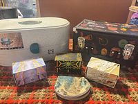 All six storage items displayed on rug
