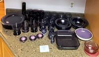 Full lot overview on countertop showing all purple glass pieces