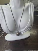Necklace displayed on bust showing full length