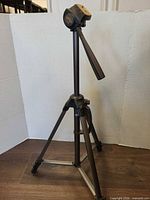 Full view of Optex T165 tripod standing extended