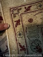 Underside and edge showing hand-knotted construction and ivory fringe