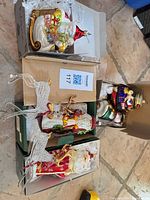 Overview of all boxed ornaments: Santa in sleigh, pair of reindeer, standing Santa, nutcracker, round/figure ornaments
