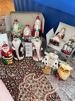 Group shot of all ten blown glass ornaments on carpet