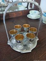 Front view of carrier holding six egg cups