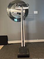 Full view of physician scale standing on floor