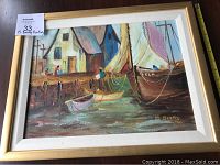 Photo of framed oil painting showing harbor scene with boats and buildings, signature M. Beatty 60 visible