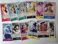 Fronts of 12 One Piece Card Game cards laid out in two rows