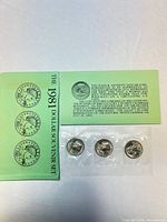 Souvenir set envelope with three coins in plastic
