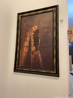 Full view of framed library scene canvas print on wall