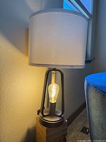 Full view of lamp with shade illuminated