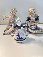 Group shot of all three porcelain figurines