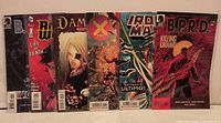 Front view of all six bagged comic books standing side by side