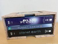 Slipcase showing spine labels of all three DVD sets