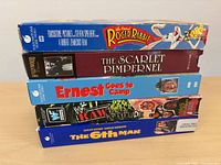 Side view showing titles on spines of all five VHS tapes