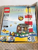 Front of LEGO Creator 5770 box showing lighthouse model, 518 pcs