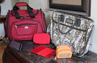 Group shot of both totes and four accessories