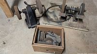 Both bench grinders/buffers and accessory box on floor