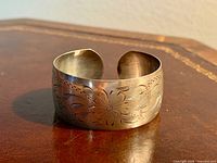Front view showing etched design and width