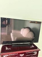 Front view of Sony Bravia TV on stand