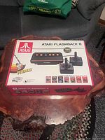 Front of Atari Flashback 8 box showing console image, joysticks and 105 games badge