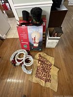 Boxed 5 ft LED snowman, two top hats, metal lantern, wreath forms, burlap sack