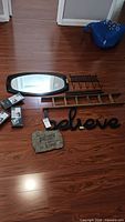 All items laid out: mirror, hook rack, ladder, sign, plaque, three boxed shelves
