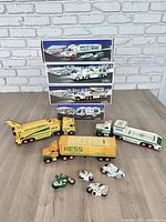 Group shot of boxed sets stacked with loose trucks and motorcycles displayed
