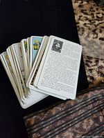 Stack of Rider-Waite tarot cards showing instruction card