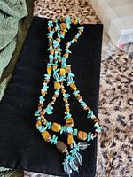 Full view of long beaded lariat showing stone types and length