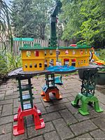 Full view of assembled elevated playset with crane, station building and supports