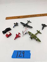 Group shot of all visible vehicles with ruler for scale