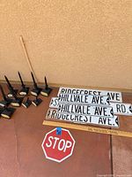 Full lot showing street signs, stop sign, solar lights
