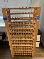 Full front view of assembled wooden wine rack showing overall structure and capacity