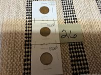 Three coin holders labeled 1909 VDB, 1920D, 1920S