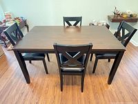dining table with four X-back chairs
