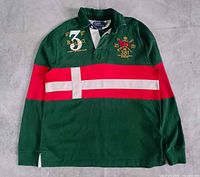 Front view showing green rugby shirt with red and white stripe, crest and number 3 embroidery