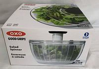 Boxed OXO Good Grips salad spinner showing product image and branding