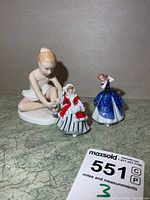 All three Royal Doulton figurines grouped together