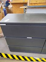 Front view of gray 3-drawer lateral cabinet