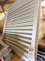 Front view of square aluminum louvered vent grille