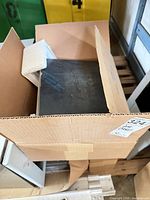 Box containing stainless steel sanitary napkin disposal with protective film