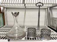 Entire lot showing pewter caddy, glass decanter with aerator, stainless rod