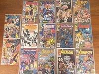 Group image of all 16 bagged Avengers comics laid out